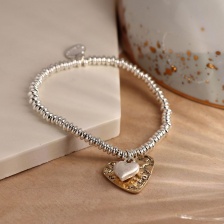 Silver Plated Bead Bracelet with Gold and Silver Hearts by Peace of Mind